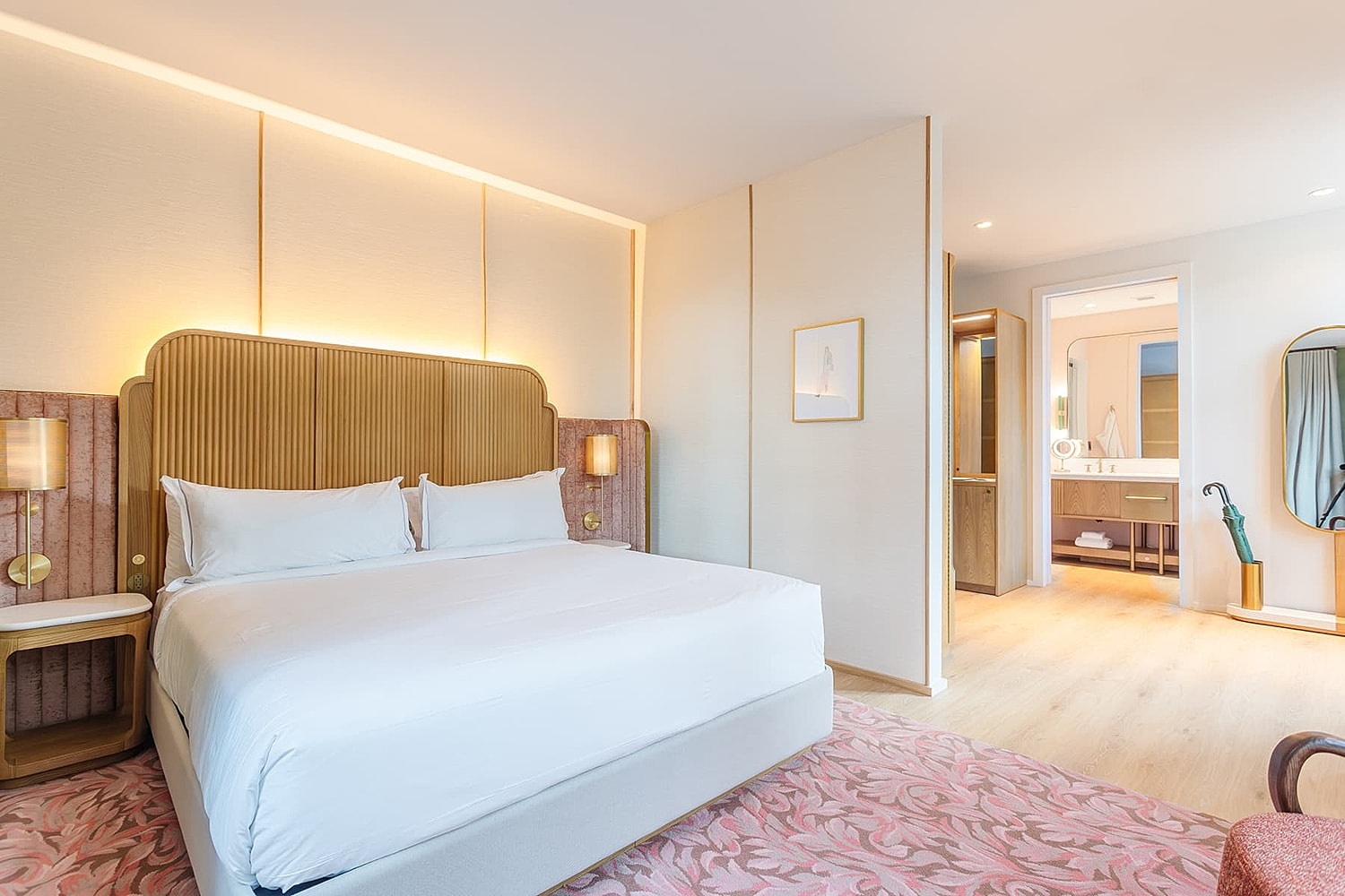 Modern hotel bedroom with elegant decor.