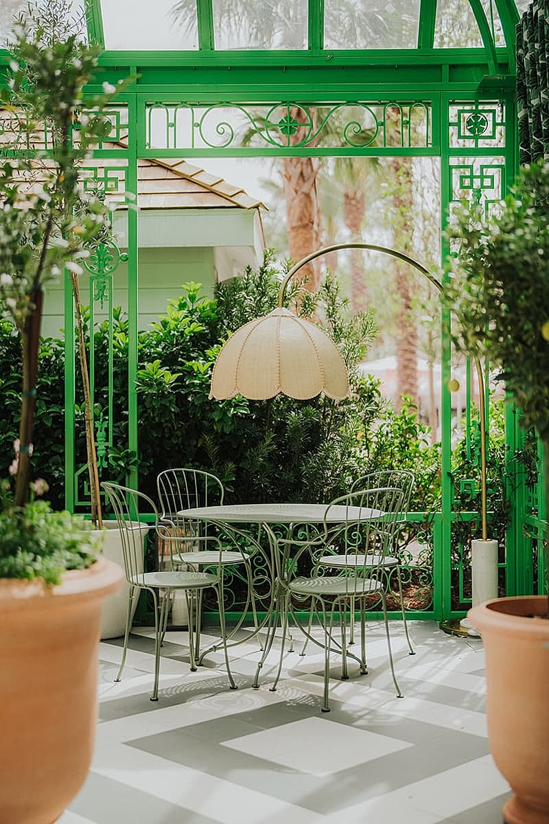 Charming outdoor dining area with green decor
