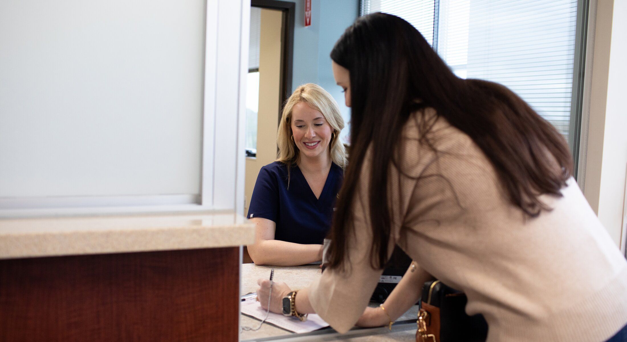 savannah facial plastic surgery reception, staff with patient